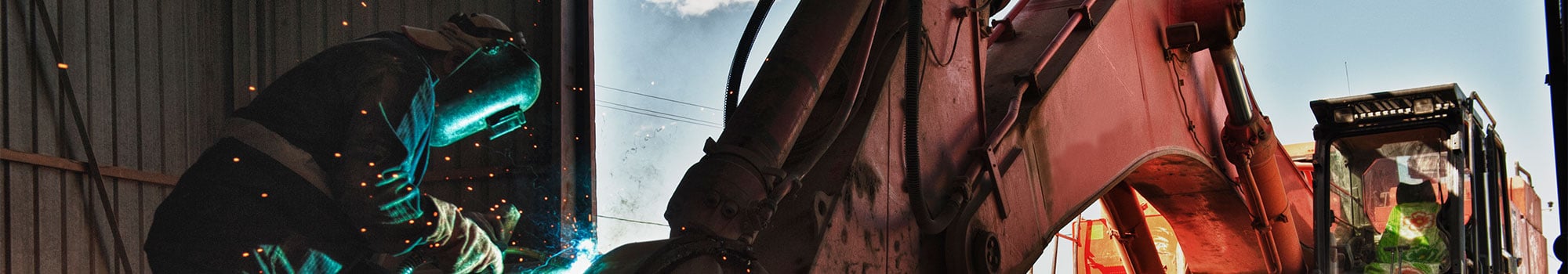 service department welding on an excavator bucket